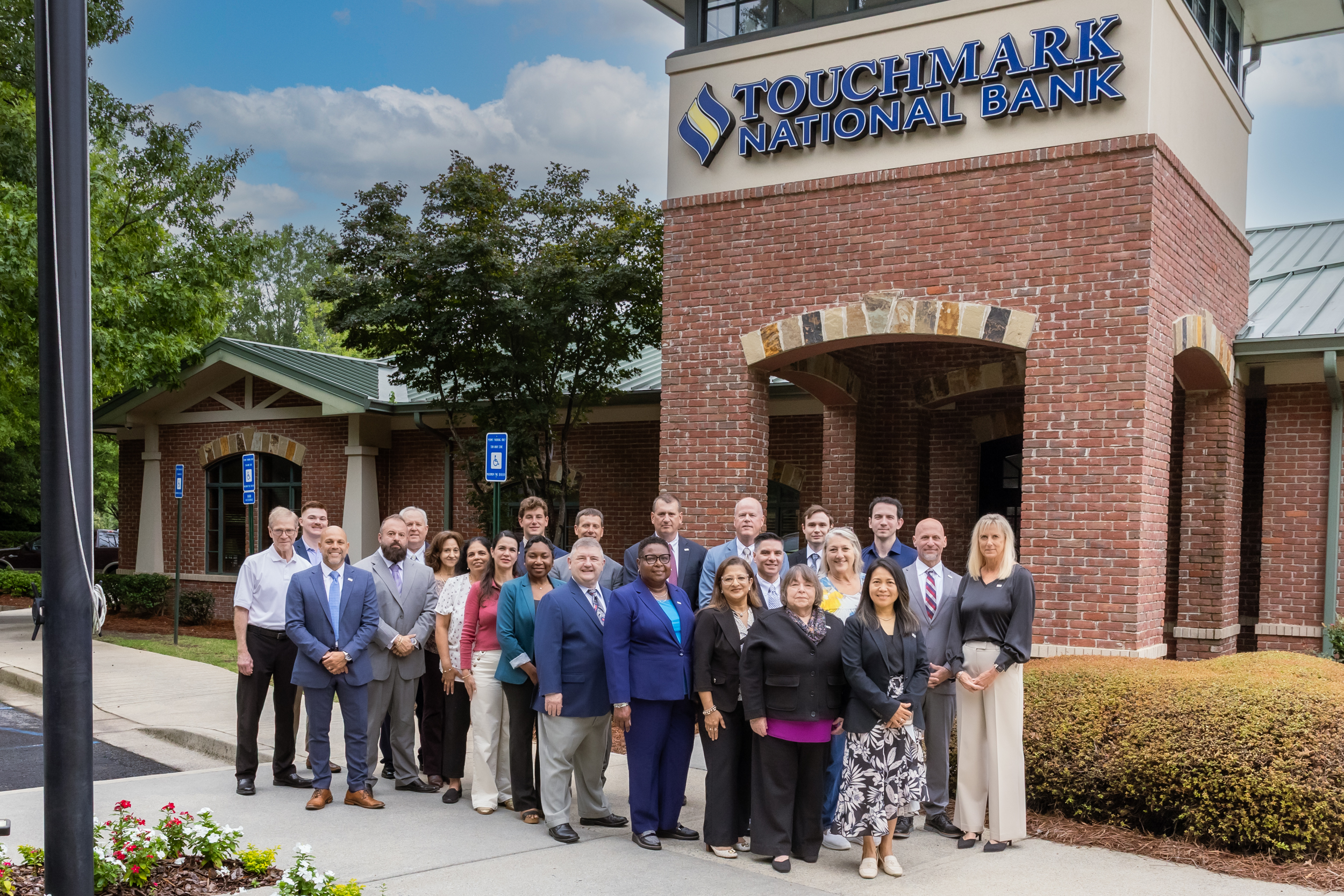 Touchmark National Bank team outside the bank